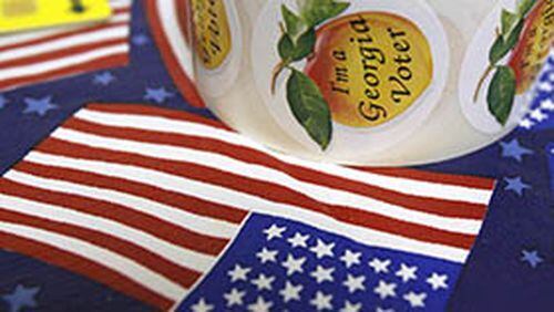 080201 -- Norcross, Ga., : (all cq) Voting stickers are shown on an American Flag table cloth during the last day of early voting for the presidential primaries at Singleton Road Activity Building Friday in Norcross, Ga., February 1, 2008. JASON GETZ / AJC