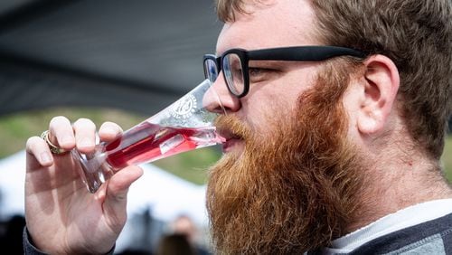 Josh Anderson samples a Savannah Transfusion drink during the Beer, Bourbon, & BBQ Festival at Atlantic Station on Saturday, March 2, 2019. STEVE SCHAEFER / SPECIAL TO THE AJC