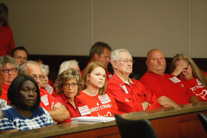 Friends and family members wore red T-shirts in support of Garrett Anderson, who is seeking a new trial following his conviction in a crash that killed two teenagers.