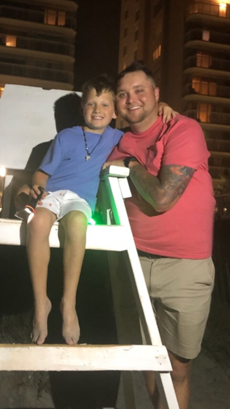 Nicolas “Blane” Dixon is shown with 9-year-old son, Caden, on a recent vacation to Myrtle Beach, S.C. (Photo courtesy of the Dixon family )