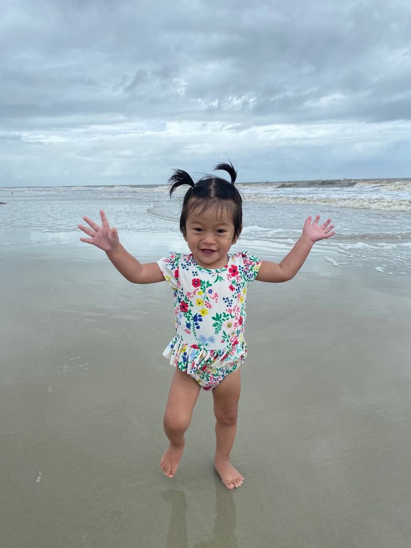 Rynli Harris was born with cardiomyopathy, but for awhile, her heart condition responded well to medication. She's seen here at the beach in healthier days. Courtesy: Harris family