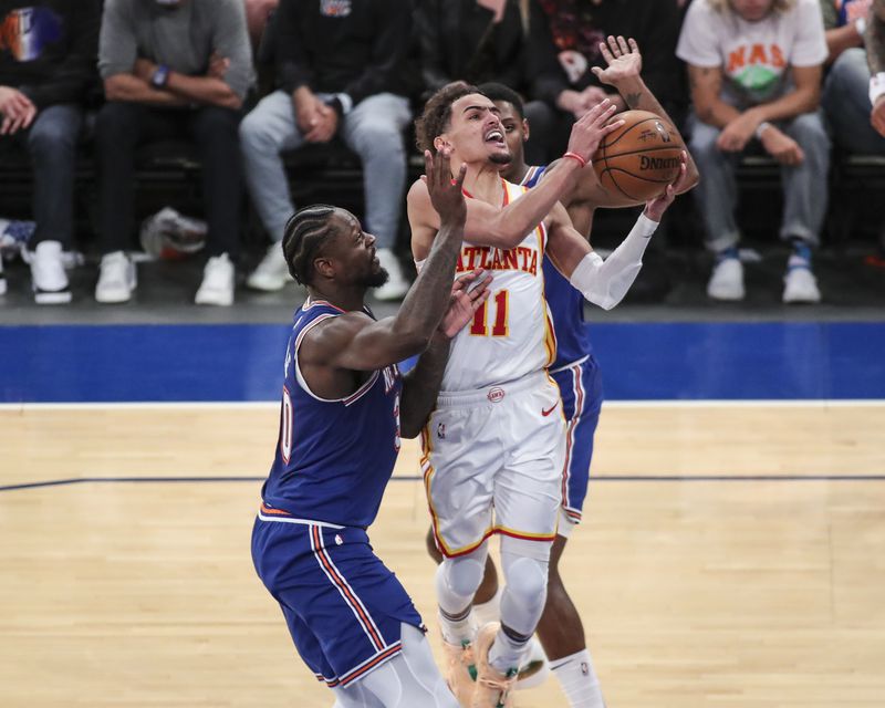 Atlanta Hawks guard Trae Young (11) drives past New York Knicks forward Julius Randle (30) in the fourth quarter of Game 5 of an NBA basketball first-round playoff series Wednesday, June 2, 2021, in New York. (Wendell Cruz/Pool Photo via AP)