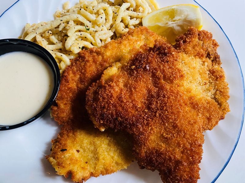 Classic wienerschnitzel with spatzle and lemon butter sauce is available from Kurt's Euro Bistro. Bob Townsend/For The AJC