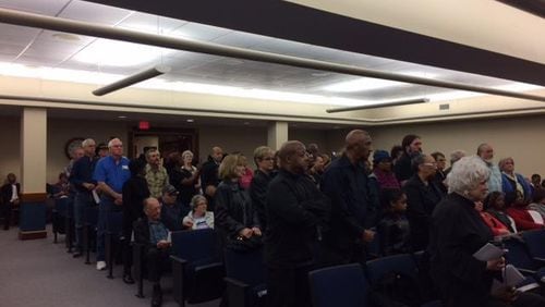 Clayton residents stand during a March 2017 meeting in protest of a County Commission decision a month earlier that stopped CCTV 23 from televising public comments.
