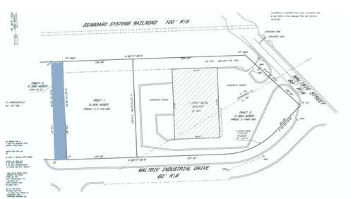 Lawrenceville will sell or transfer narrow strips of land owned by the city including this small parcel on Malbtie Industrial Drive. (Courtesy City of Lawrenceville)