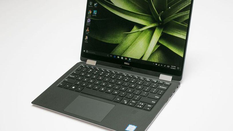 Despite a few trade-offs in ports and processing power, this slimmer hybrid version of the Dell XPS 13 is an excellent full-time laptop and part-time tablet. (Sarah Tew/CNET/TNS)