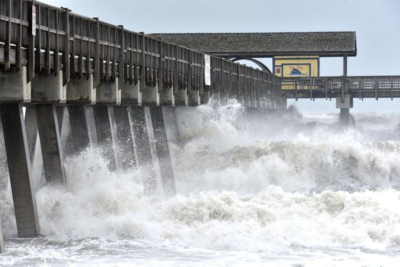 Waves crash against the Tybee Beach Pier on Wednesday, September 4, 2019. Gov. Brian Kemp on Wednesday expanded a state of emergency to include nine additional counties as Hurricane Dorian’s outer rain bands reached the Georgia coast.