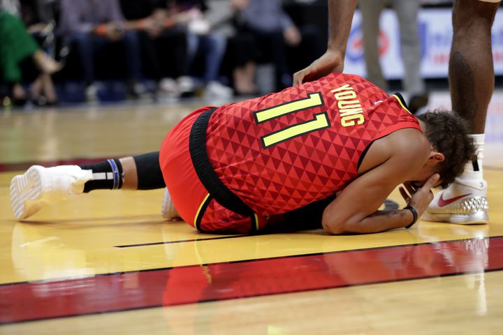 Photos: Hawks star Trae Young injures ankle