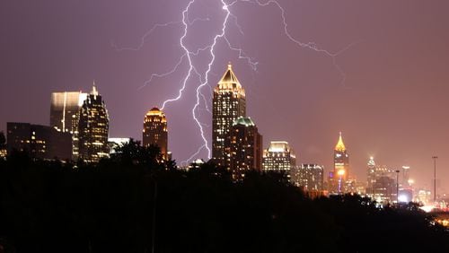 July 14, 2015 Atlanta: Lightning lights up the Midtown sky Tuesday evening July 14, 2015. Ben Gray / bgray@ajc.com