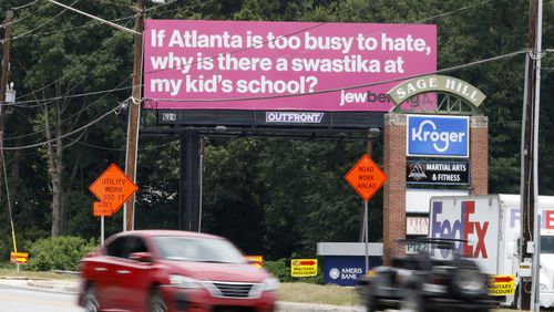 A hot pink billboard on Briarcliff Road in Atlanta challenges viewers to fight antisemitism. It's one of 10 coming to the metro Atlanta area through the fall. (Miguel Martinez / Miguel.martinezjimenez@ajc.com)