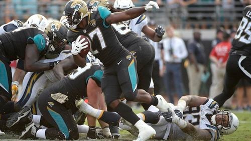 Leonard Fournette runs during the second half of an NFL football game Sunday, Nov. 12, 2017, in Jacksonville, Fla. The Jaguars won in overtime, 20-17. (AP Photo/Phelan M. Ebenhack)