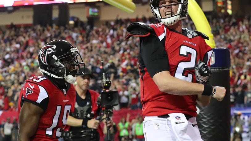 Falcons quarterback Matt Ryan reacts to scoring a touchdown on a quarterback keeper in the first half of the NFC Championship Game against the Green Bay Packers Sunday, Jan. 22, 2017, in Atlanta. (Curtis Compton/ccompton@ajc.com)