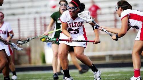 Girls lacrosse and youth baseball programs and camps will be offered at sites around Milton under agreements approved by the City Council. AJC FILE