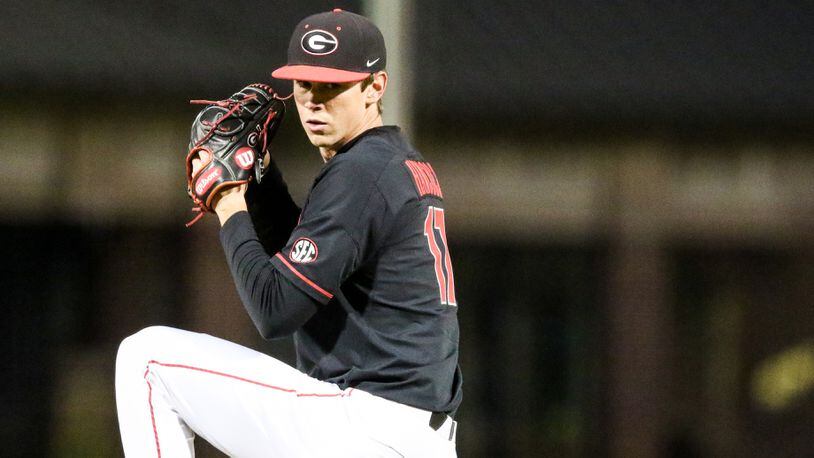 Georgia pitcher Emerson Hancock (17) winds up to deliver against UMass Friday, March 6, 2020, at Foley Field in Athens.