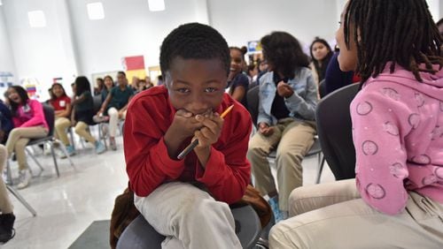Jacob Arnold, 10, reacts as he learns he will be getting a laptop as part of Internet Essentials program during Internet Essentials Back to School Event at Morrow Middle School on Wednesday, October 4, 2017. HYOSUB SHIN / HSHIN@AJC.COM