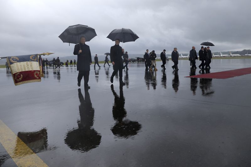 Chinese President Xi Jinping, left, and French President Emmanuel Macron review the troops before Xi Jinping's departure, Tuesday, May 7, 2024 at the Tarbes airport, southwestern France. French President Emmanuel Macron made a point of inviting Chinese President Xi Jinping to the Tourmalet Pass near the Spanish border, where Macron spent time as a child visiting his grandmother. (AP Photo/Aurelien Morissard, Pool)