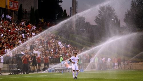 Atlanta United forward Brandon Vazquez looks on as the sprinklers come on during the match against Charleston Battery causing a delay during the second half in a U.S. Open Cup match on Wednesday, June 6, 2018, in Kennesaw.  Curtis Compton/ccompton@ajc.com