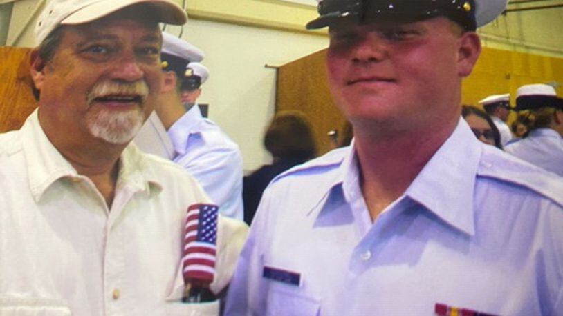 In this undated photo, Gregory McMichael is seen with his son Travis McMichael, when Travis was in the Coast Guard. (Handout)