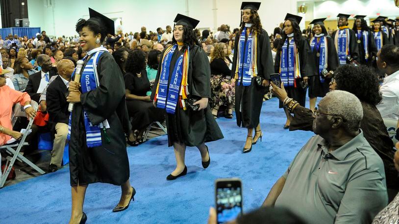 A group of women enter the Spelman College Commencement ceremony, Sunday, May 17, 2015, at the Georgia International Convention Center in Atlanta. (Special/John Amis)