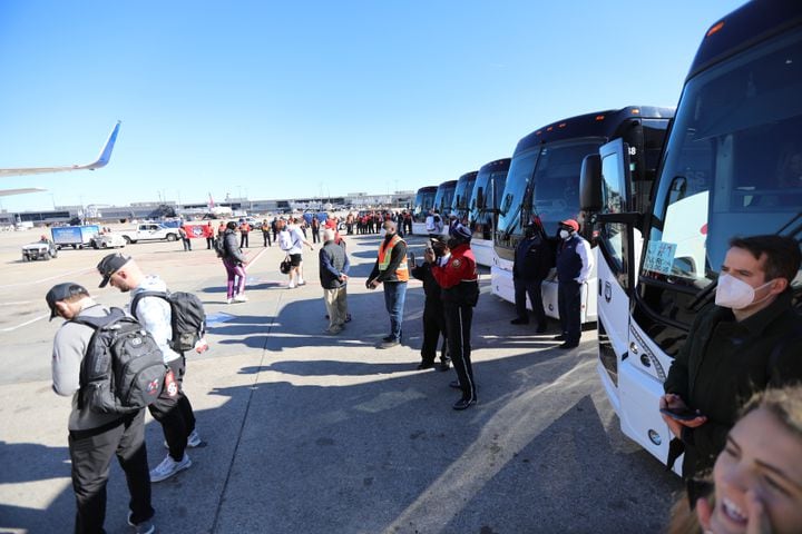Six buses are ready to pick up the Bulldogs a day after their 33-18 win against the Alabama Crimson Tide. Tuesday, January 11, 2022. Miguel Martinez for The Atlanta Journal-Constitution  Tuesday, January 11, 2022.