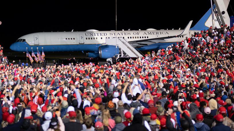 Supporters of President Donald Trump gathered for a campaign rally at the Richard B. Russell Airport in Rome on Nov. 1, despite an order by Gov. Brian Kemp banning gatherings of 50 people or more without distancing measures.  (PHOTO by Ben Gray for the Atlanta Journal-Constitution)