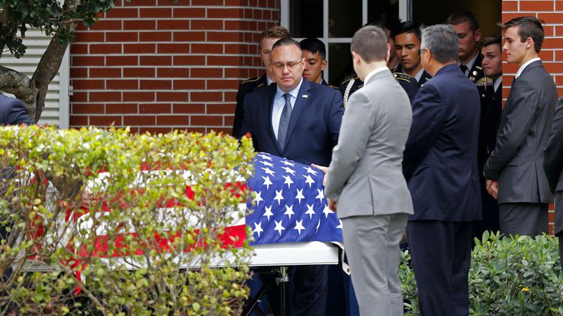 The casket carrying the body of Alaina Petty, 14, is removed following her funeral Monday, Feb. 19, 2018, in Coral Springs, Fla. Petty, a JROTC member, was one of 17 people killed in a Valentine's Day mass shooting at Marjory Stoneman Douglas High School in Parkland.