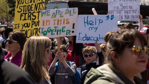 Thousands gathered and marched in a pitcket line outside the Oklahoma state Capitol building during the third day of a statewide education walkout on April 4, 2018 in Oklahoma City, Oklahoma. Teachers and their supporters are demanding increased school funding and pay raises for school workers. (Photo by Scott Heins/Getty Images)