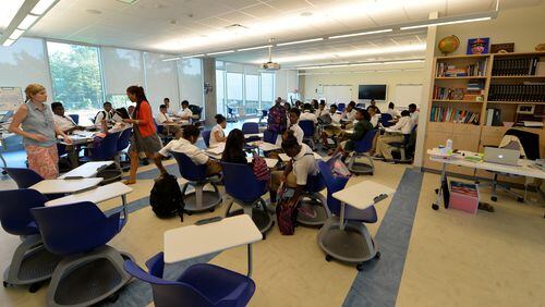 In a file photo from 2014, an open classroom design allows for co-teaching of  two classes in some areas. The Charles R Drew Charter School Junior and Senior Academy at the Charlie Yates campus is shown. KENT D. JOHNSON/KDJOHNSON@AJC.COM