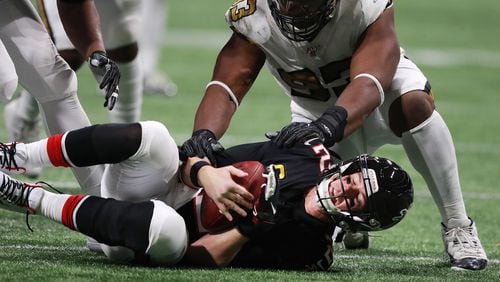 Saints defensive tackle David Onyemata taps Falcons quarterback Matt Ryan on the ground for one of nine sacks by New Orleans Thursday, Nov. 28, 2019, at Mercedes-Benz Stadium in Atlanta.