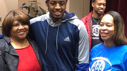 Tennessee State University football player Christion Abercrombie, who suffered a brain injury in a September game against Vanderbilty, completed an inpatient program at Atlanta’s Shepherd Center on Friday, about a month ahead of schedule, officials said. He was surrounded by relatives, including mother Staci Abercrombie (right).