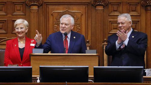 Gov. Nathan Deal, standing with Speaker David Ralston and first lady Sandra Deal, addresses the House for his last Sine Die. Thursday was the 40th and final day of the 2018 General Assembly. BOB ANDRES /BANDRES@AJC.COM