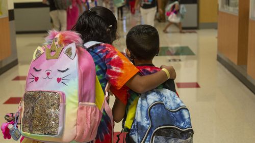 Students walk through the hallway on the first day of school at Clark Creek Elementary School in Acworth, Georgia, on August 2, 2021. (Rebecca Wright for the Atlanta Journal-Constitution)