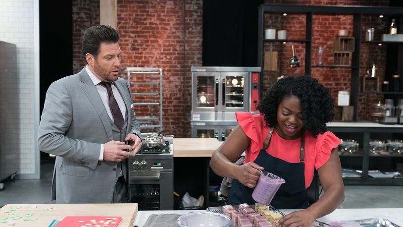 Host Scot Contant (L) and Contestant Lasheeda Perry during the Skills Challenge, Cake, Glorious Cake, Make One Dozen Decorated Petits Fours, as seen on Best Baker in America, Season 2.