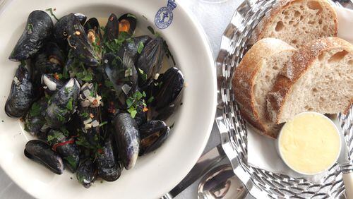 In an undated handout photo, mussels with chili and lemongrass at the Seaside Boarding House Restaurant and Bar in Dorset, England﻿. The hotel and restaurant may be ensconced in rural England, but its menu and sensibilities are pure well-heeled London — with a touch of beach culture: white and blue-gray walls, minimalist furniture and crisp white tablecloths.