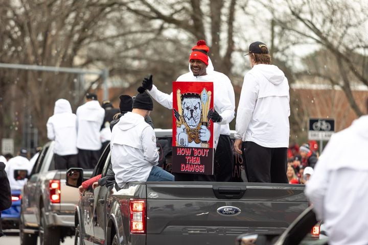 A sign reads “How ‘bout them Dawgs!” in the UGA National Championship Celebration Parade in Athens, GA., on Saturday, January 15, 2022. (Photo/ Jenn Finch)