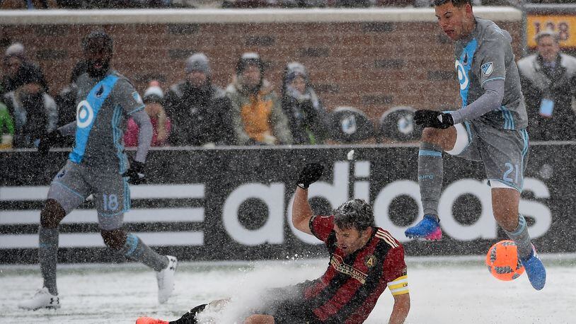 Michael Parkhurst of Atlanta United FC challenges Christian Ramirez  of Minnesota United FC for the ball during the first half of the match on March 12, 2017 at TCF Bank Stadium in Minneapolis, Minnesota. (Photo by Hannah Foslien/Getty Images)