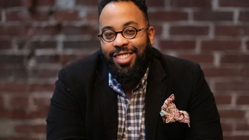 February 8, 2016 Atlanta: Atlanta poet and Emory professor Kevin Young, shown at Ticonderoga Club in the Krog Street Market, is the author of “Blue Laws: Selected and Uncollected Poems, 1995-2015.” Ben Gray / bgray@ajc.com