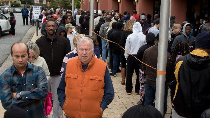 People wait in a long line to vote Saturday, Oct. 27, 2018, at the Cobb County Board of Elections and Registration office in Marietta. (Photo: STEVE SCHAEFER / SPECIAL TO THE AJC)