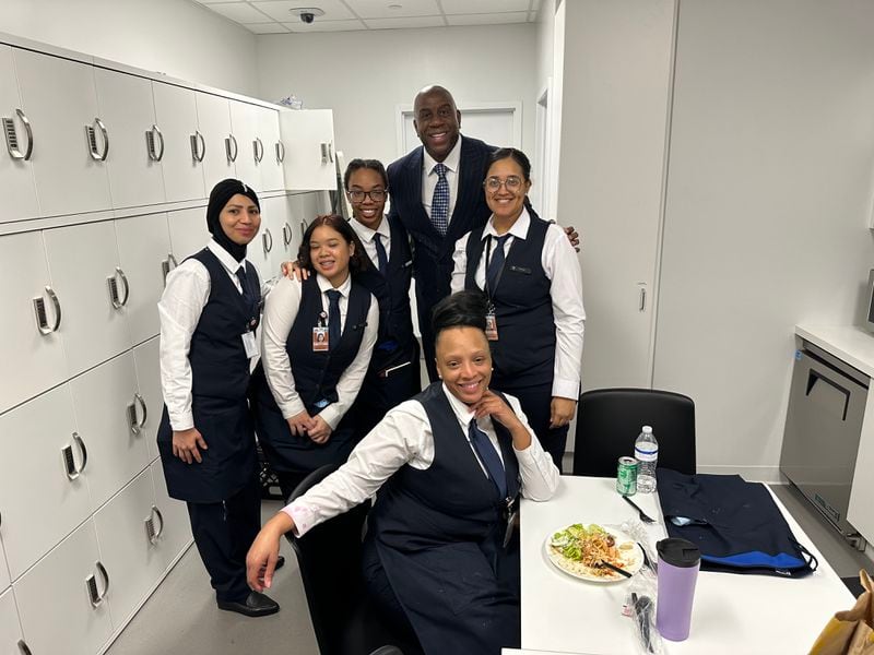Magic Johnson (center) with employees at the American Express Centurion Lounge on Wednesday, February 14, 2024, at Hartsfield-Jackson International Airport.
COURTESY OF SODEXOMAGIC