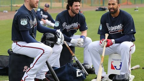 The Braves’ (from left) Freddie Freeman, Dansby Swanson and Matt Kemp fared differently in FanGraph’s positional power rankings. (Curtis Compton/ccompton@ajc.com)