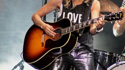 Sheryl Crow rocks it onstage at Chastain Park Amphitheatre on Sunday night. Photo: Melissa Ruggieri/AJC