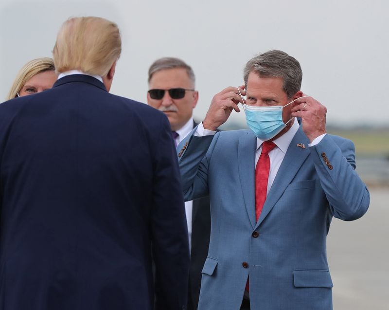 Gov. Brian Kemp, shown greeting Donald Trump on a visit to Georgia in 2020, now pushes back against the former president, including a rebuke this week over his false claims about the last presidential election. Kemp will speak at the Gathering after contributing $100,00 to co-host the event for non-Trump Republicans and Erick Erickson's listeners on News 95.5 and AM 750 WSB. (Curtis Compton/Atlanta Journal-Constitution/TNS)