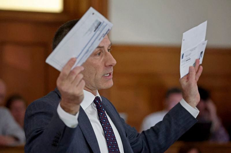 Defense Attorney David Yannetti holds up evidence at the murder trial of Karen Read at Dedham Superior Court on Tuesday, May 7, 2024, in Dedham, Mass. Read is facing charges including second degree murder in the 2022 death of her boyfriend Boston Officer John O’Keefe. (Stuart Cahill/The Boston Herald via AP, Pool)