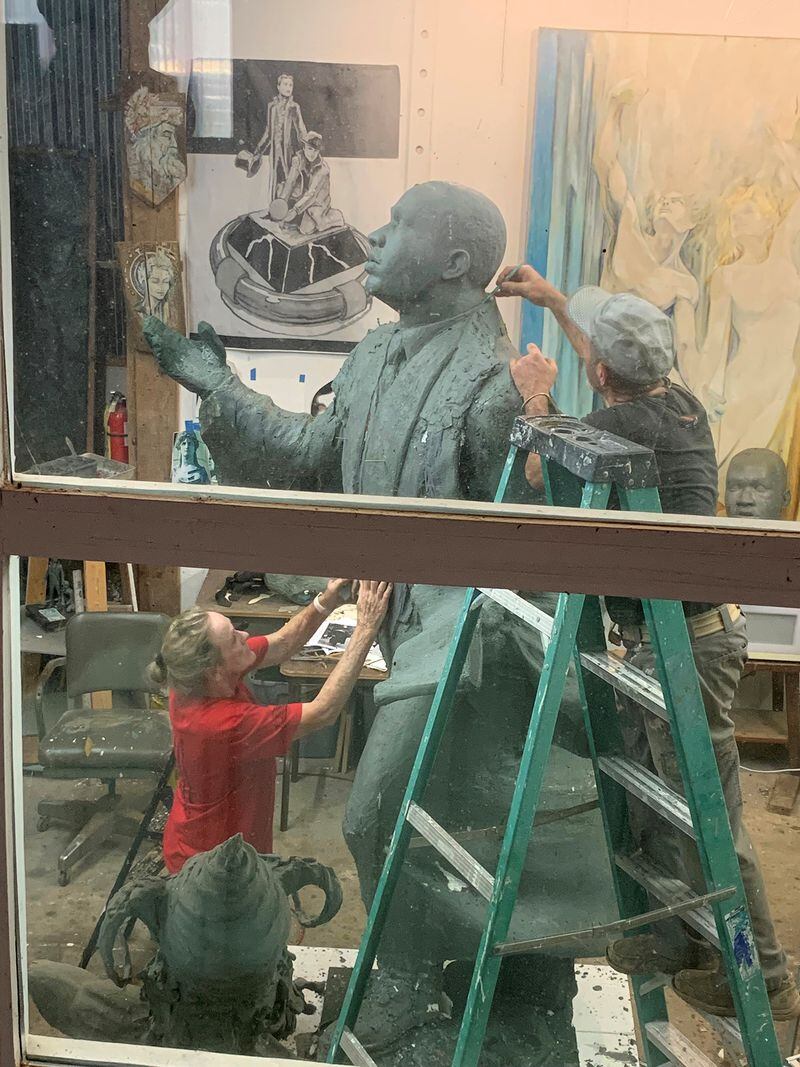 Sculptors Stan Mullins and Kathy Fincher work together on the statue of Martin Luther King, Jr. at Mullins' Athens studio. (Courtesy of Kathy Fincher)