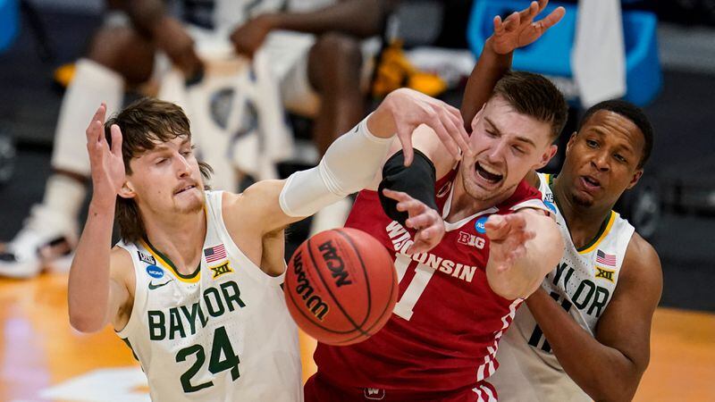 Baylor guard Matthew Mayer (24) blocks the shot of Wisconsin forward Micah Potter (11) in the first half of a second-round game in the NCAA Tournament Sunday, March 21, 2021, at Hinkle Fieldhouse in Indianapolis. (Michael Conroy/AP)