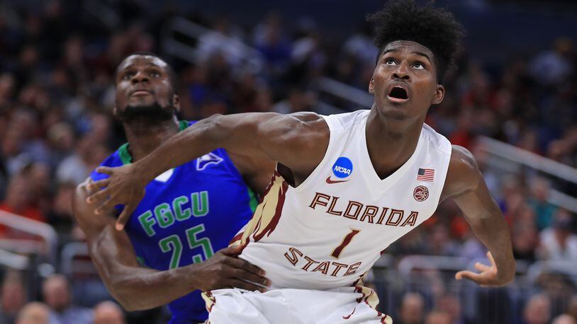 Florida State alum Jonathan Isaac helps others stand tall during