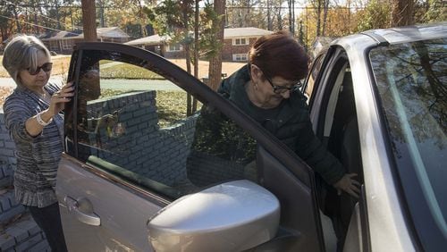 Melissa Staton (left) helps Linda Wayman (right) into her car as they prepare to head to Piedmont Fayette hospital for Linda's chemotherapy treatment appointment, Monday, November 25, 2019. Melissa has been driving for the American Cancer Society's Road To Recovery program for about 2 years. She has been transporting Luda for more than 2 months. (Alyssa Pointer/Atlanta Journal Constitution)