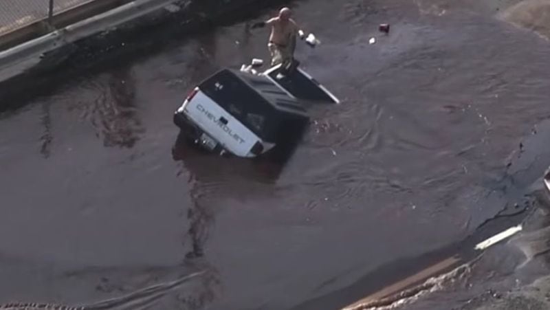 Crews rescued a driver after his truck was swallowed up by a sinkhole in the water main break. (Boston25News.com)