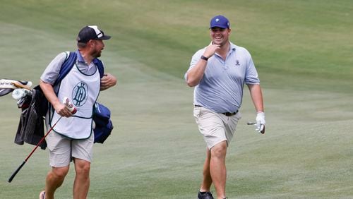 Toby Walker, Australia, who finished 24th, talks with his caddie during the final round of the Dogwood Invitational Golf Tournament in Atlanta on Saturday, June 11, 2022.  (Bob Andres for the Atlanta Journal-Constitution)