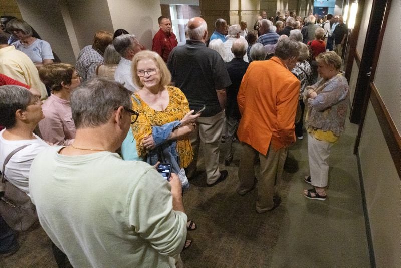 A crowd fills the hallway waiting to enter the courtroom before a hearing brought against the North Georgia Conference of the United Methodist Church in Marietta. (Steve Schaefer/steve.schaefer@ajc.com)